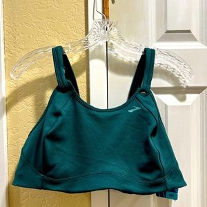 Brooks, new with tags green/teal sports bra. Never worn.